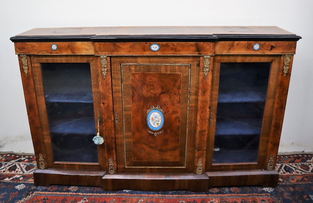 A Victorian walnut credenza the breakfront top with ebonised edge above a central cupboard and two - Image 2 of 16