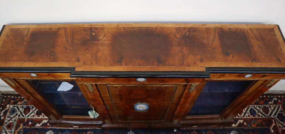 A Victorian walnut credenza the breakfront top with ebonised edge above a central cupboard and two - Image 16 of 16