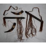 A leather quiver, with a shoulder strap and tassels,
