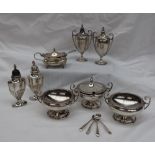 A George V silver five piece cruet set, comprising a pair of open table salts,