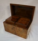 A Victorian walnut tea caddy, of domed form, the interior with two removable lidded compartments,