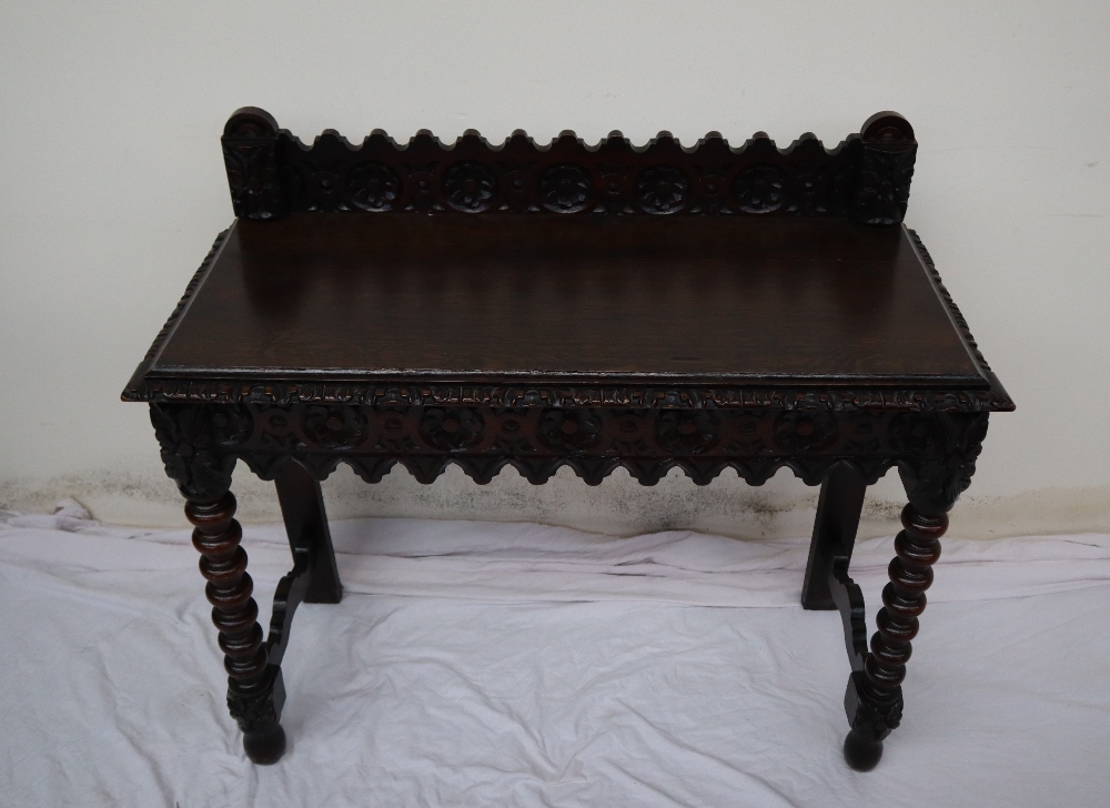 A 19th century carved oak side table, the raised back carved with arched and flowers heads, - Image 2 of 9