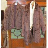 A fur coat together with fur stoles