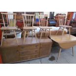 An Ercol teak sideboard together with table and for chairs, the chairs stamped Reg Design No.