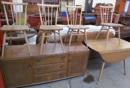 An Ercol teak sideboard together with table and for chairs, the chairs stamped Reg Design No.