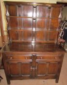 An Ercol dresser with a planked rack,