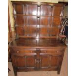 An Ercol dresser with a planked rack,