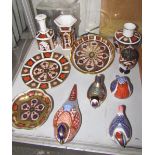 A Royal Crown Derby pheasant paperweight together with three other Royal Crown Derby bird