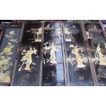 A set of four Japanese lacquer and mother of pearl panels,