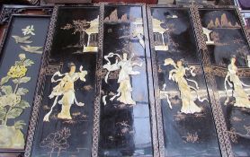 A set of four Japanese lacquer and mother of pearl panels,