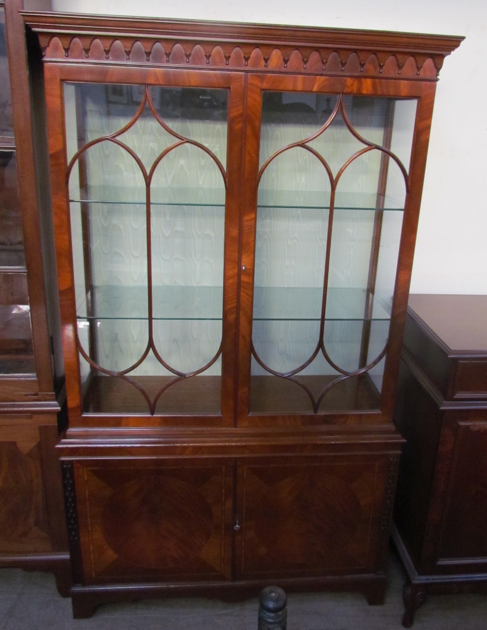A 20th century mahogany bookcase with a moulded cornice above a pair of glazed doors, - Image 2 of 3
