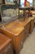 A 20th century oak sideboard together with an oak stool and a brass fire guard
