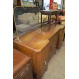 A 20th century oak sideboard together with an oak stool and a brass fire guard