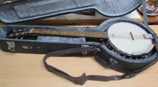 A Godman six string banjo, with strap,