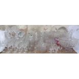 A large quantity of crystal and other drinking glasses, decanters, bowls,
