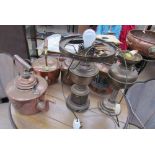 A copper lamp together with copper kettles, oil lamps,