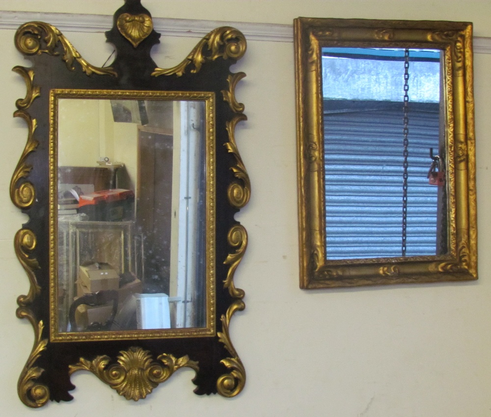 A mahogany and gilt decorated wall mirror with a heart shaped cresting and another gilt wall