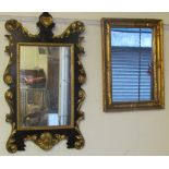 A mahogany and gilt decorated wall mirror with a heart shaped cresting and another gilt wall