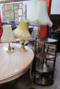 A brass standard lamp together with two brass table lamps,