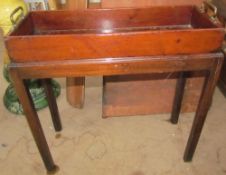 A George III mahogany plant trough and stand of rectangular form, with brass handles,