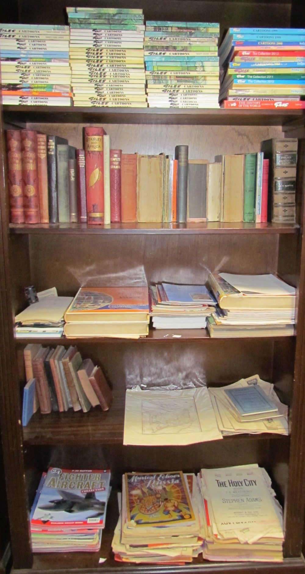 A large collection of Giles Annuals together with Historical books, stamp books, magazines,