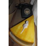 A green bakelite telephone together with a cheese dish and cover