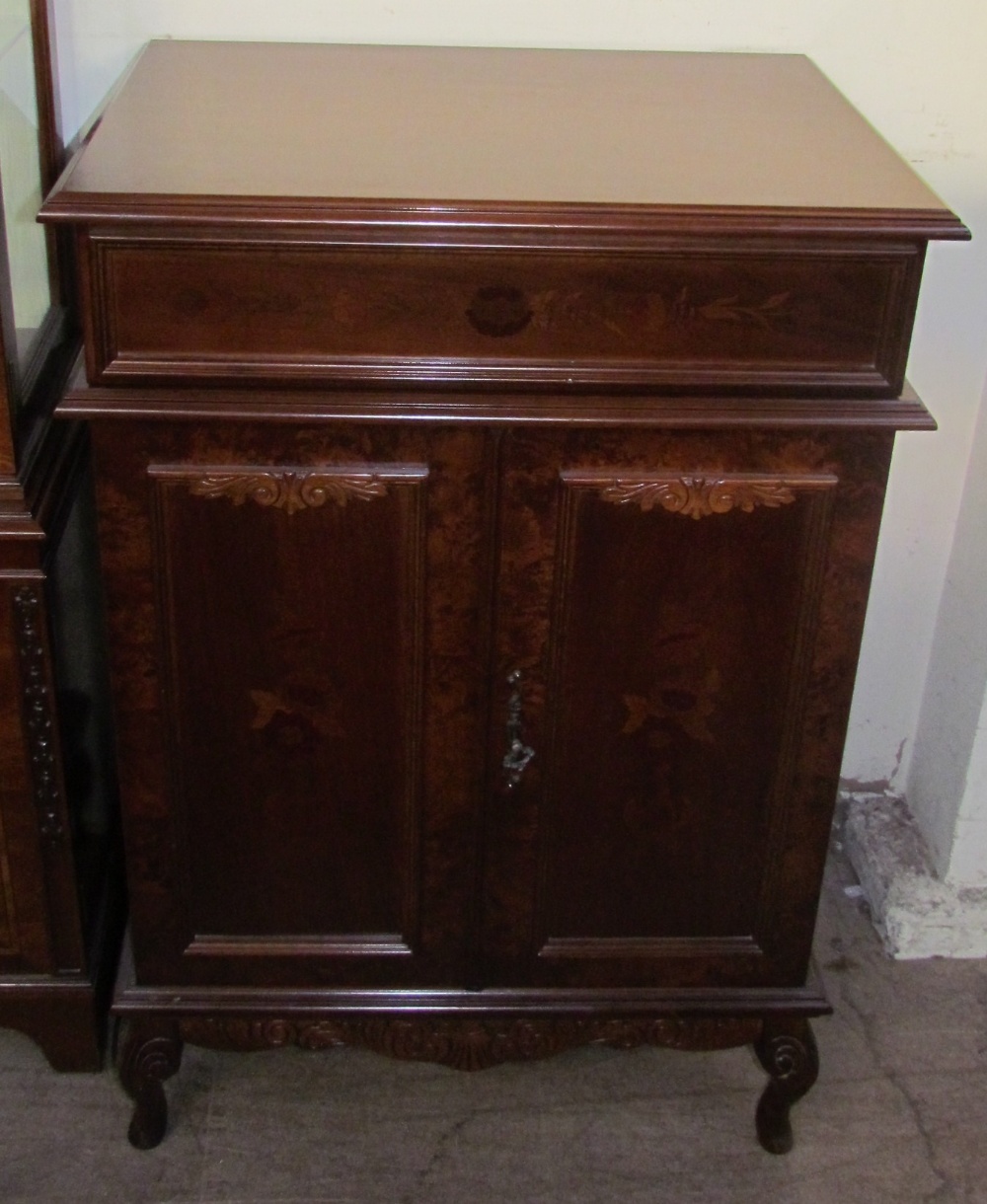 A 20th century mahogany bookcase with a moulded cornice above a pair of glazed doors, - Image 3 of 3