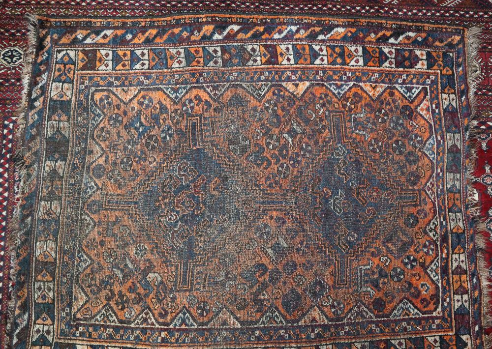 A red ground Turkoman rug with five geometric medallions to a red ground together with a rug with - Image 2 of 2