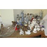 A collection of Lladro figures including ladies,