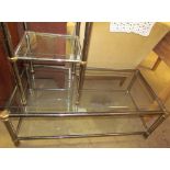 A chrome and glass two tier coffee table together with a similar side table