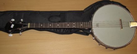 A Tonewood four string banjo with soft case and stand