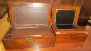 A Victorian walnut laptop desk with an inset writing slope together with another smaller example