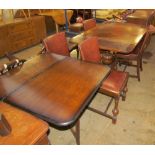 An oak extending dining table together with a set of four dining chairs, a sideboard,