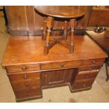 A Victorian mahogany pedestal desk with a rectangular moulded top above a central kneehole and two