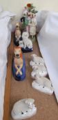 A pair of Staffordshire greyhound pen stands together with Staffordshire poodles,