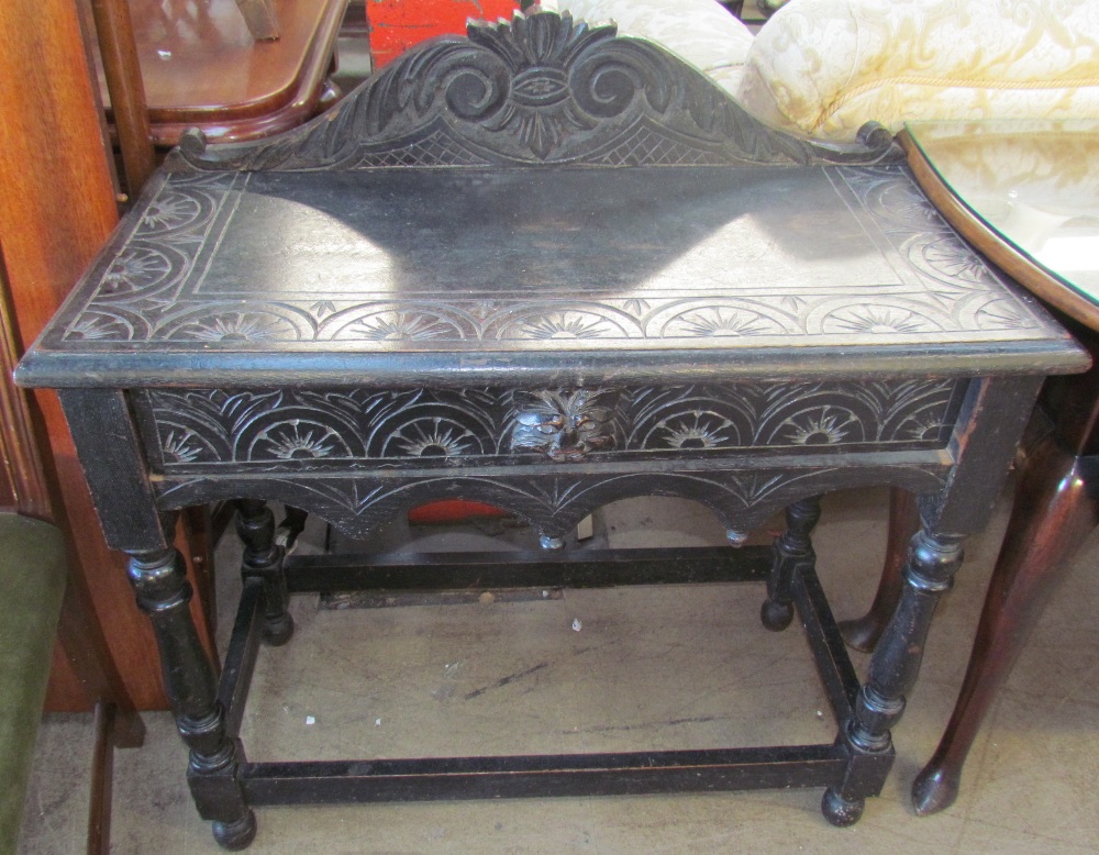 A 19th century ebonised low countries side table with a single drawer and lions mask handle on - Image 2 of 2