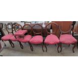 A matched set of six Victorian balloon back dining chairs together with a foot stool