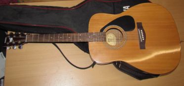 A Yamaha F310 acoustic guitar,