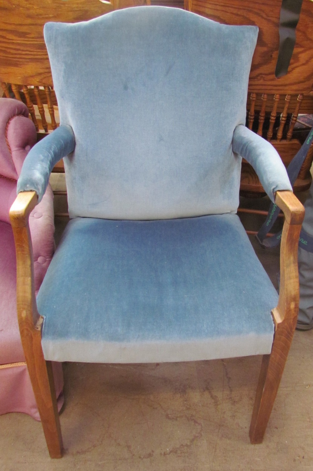 An upholstered George III mahogany elbow chair together with a 19th century mahogany bordaloue with