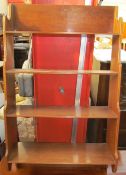 A mahogany waterfall hanging shelves with four shelves