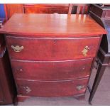 A mahogany chest of drawers with three long drawers on bracket feet