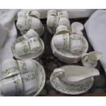 A Royal Doulton Ainsdale pattern H5038 part tea and coffee set together with a Beswick foal