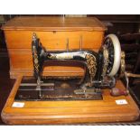 A cased Bradbury sewing machine