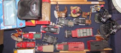 A collection of model cars together with Indian figures etc