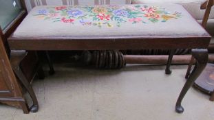 A duet stool with a woolwork top on cabriole legs and pad feet