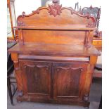 A Victorian mahogany chiffonier with a raised superstructure and shelf,