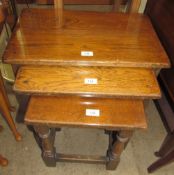 A nest of three oak tables
