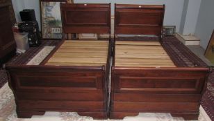 A pair of modern mahogany single sleigh beds,