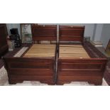 A pair of modern mahogany single sleigh beds,