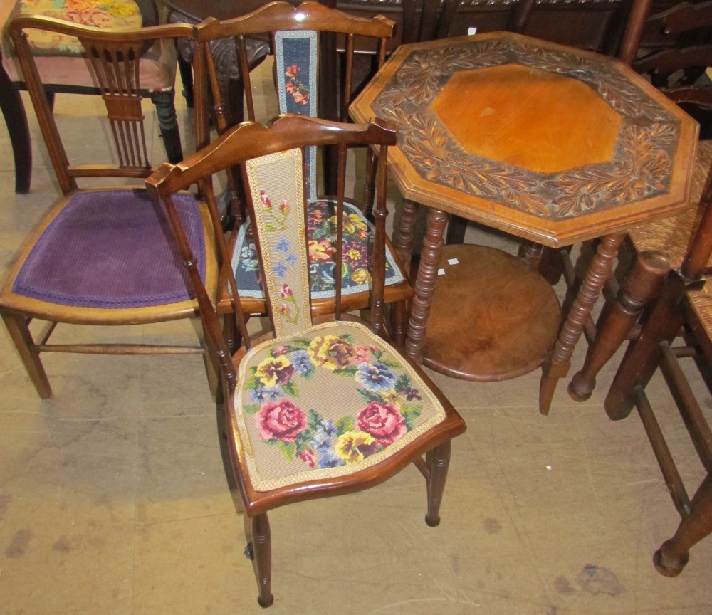 A carved occasional table together with a pair of bedroom chairs and a salon chair